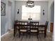 Formal dining room with wooden table, elegant chairs, and modern light fixture at 3092 S Legacy Park Blvd, Fort Mill, SC 29707
