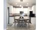 Bright kitchen featuring white cabinets, stainless steel appliances, and an eat-in area at 3092 S Legacy Park Blvd, Fort Mill, SC 29707