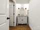 Bathroom features a vessel sink with a vintage white vanity at 3408 Sandalwood Ln, Waxhaw, NC 28173