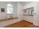 Bathroom featuring built-in bench and a vanity with granite countertop at 3408 Sandalwood Ln, Waxhaw, NC 28173