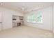 Bedroom features built-in shelves and a ceiling fan at 3408 Sandalwood Ln, Waxhaw, NC 28173