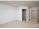 Neutral bedroom with a walk-in closet and white trim with carpet flooring and recessed lights at 3408 Sandalwood Ln, Waxhaw, NC 28173