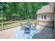 Inviting back deck offers outdoor seating and views of the lush greenery at 3408 Sandalwood Ln, Waxhaw, NC 28173