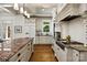 Gourmet kitchen with a granite countertops, an island and a gas range at 3408 Sandalwood Ln, Waxhaw, NC 28173