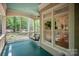 Relax on the covered porch with a swing and enjoy the views of the wooded backyard at 3408 Sandalwood Ln, Waxhaw, NC 28173