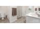 Clean, bright bathroom featuring double vanity, separate shower, soaking tub, and neutral tile flooring at 3654 Azalea Ridge Dr, Mount Holly, NC 28102