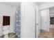 Bathroom featuring a toilet and shower/tub with a patterned curtain at 3654 Azalea Ridge Dr, Mount Holly, NC 28102