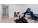 Bedroom with desk, Peloton bike, and wood shelf for storage at 3654 Azalea Ridge Dr, Mount Holly, NC 28102