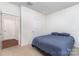 Simple bedroom with neutral carpet and access to other rooms at 3654 Azalea Ridge Dr, Mount Holly, NC 28102