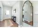 Inviting foyer featuring hardwood floors, a console table, and decorative mirror at 3654 Azalea Ridge Dr, Mount Holly, NC 28102