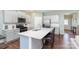 Modern kitchen featuring stainless steel appliances, white cabinets, and a spacious island with seating at 3654 Azalea Ridge Dr, Mount Holly, NC 28102