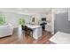 Modern kitchen featuring stainless steel appliances, white cabinets, and a spacious island with seating at 3654 Azalea Ridge Dr, Mount Holly, NC 28102