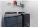 Laundry room featuring side-by-side washer and dryer with wire shelf at 3654 Azalea Ridge Dr, Mount Holly, NC 28102
