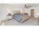 Serene main bedroom with a neutral color scheme, ceiling fan and ample natural light at 3654 Azalea Ridge Dr, Mount Holly, NC 28102