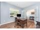 Cozy office featuring hardwood floors, a large window, and an open doorway at 3654 Azalea Ridge Dr, Mount Holly, NC 28102