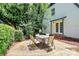 Backyard featuring a cozy patio with an outdoor table and chairs at 3909 Woodbriar Trl, Charlotte, NC 28205