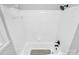 Clean, all-white bathroom with tub/shower combination and modern fixtures at 3909 Woodbriar Trl, Charlotte, NC 28205