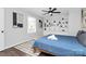 Cozy bedroom featuring built-in shelving, a comfortable bed, and ample natural light at 3909 Woodbriar Trl, Charlotte, NC 28205