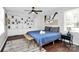 Bright bedroom featuring a comfortable bed, a large window, and built-in shelving at 3909 Woodbriar Trl, Charlotte, NC 28205