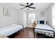 Bright and airy bedroom featuring two beds and a neutral color palette at 3909 Woodbriar Trl, Charlotte, NC 28205
