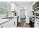 Stylish kitchen with quartz countertops and stainless-steel appliances, window providing natural light at 3909 Woodbriar Trl, Charlotte, NC 28205