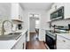 Bright kitchen with ample countertop space, stainless-steel appliances, and a well-lit area at 3909 Woodbriar Trl, Charlotte, NC 28205