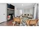 Contemporary living room showcasing a brick fireplace, modern furniture, and stylish decor elements at 3909 Woodbriar Trl, Charlotte, NC 28205