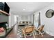 Cozy living room with a fireplace, comfortable seating, and plenty of natural light from the French doors at 3909 Woodbriar Trl, Charlotte, NC 28205