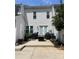 Back patio with outdoor seating, a fire pit, and access to a small garden area at 4103 Christine Ln # E, Waxhaw, NC 28173