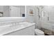 Bathroom boasts modern vanity with white marble countertop, walk-in shower and tiled floor at 4103 Christine Ln # E, Waxhaw, NC 28173