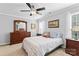 Comfortable bedroom features ceiling fan, natural light and ample furniture at 4103 Christine Ln # E, Waxhaw, NC 28173