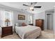 Cozy bedroom features neutral walls, ceiling fan and comfortable bedding at 4103 Christine Ln # E, Waxhaw, NC 28173