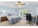 Well-lit bedroom with a ceiling fan and a work-from-home space at 4103 Christine Ln # E, Waxhaw, NC 28173