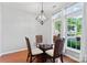 Bright breakfast nook features hardwood floors, modern chandelier, and window views at 4103 Christine Ln # E, Waxhaw, NC 28173