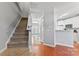 Bright foyer boasts hardwood floors and staircase leading to the upper level at 4103 Christine Ln # E, Waxhaw, NC 28173