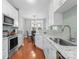 Updated kitchen showcasing white cabinetry, granite countertops, and stainless steel appliances at 4103 Christine Ln # E, Waxhaw, NC 28173