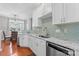 Bright kitchen with white cabinets, granite counters, and access to the dining area at 4103 Christine Ln # E, Waxhaw, NC 28173