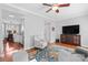 Open-concept living room showcasing hardwood floors and seamless flow into the kitchen at 4103 Christine Ln # E, Waxhaw, NC 28173