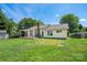 Expansive backyard with wooden fence and a back deck featuring pergola at 4507 Mackinac St, Charlotte, NC 28269