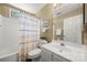 Relax in this bathroom, showcasing a shower-tub combo, modern sink, and ample counter space at 4507 Mackinac St, Charlotte, NC 28269