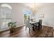 Cozy dining room filled with natural light featuring a chandelier and backyard access at 4507 Mackinac St, Charlotte, NC 28269