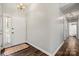 Bright and airy foyer featuring dark wood floors, a neutral color palette, and a stylish entry door at 4507 Mackinac St, Charlotte, NC 28269