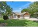 Charming front exterior with a brick and siding facade, two-car garage, and green lawn at 4507 Mackinac St, Charlotte, NC 28269