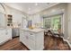 Updated kitchen with island, stainless steel appliances, and breakfast nook with natural light at 4507 Mackinac St, Charlotte, NC 28269