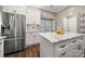Modern kitchen with stainless steel refrigerator and large granite countertop island at 4507 Mackinac St, Charlotte, NC 28269