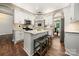 Spacious kitchen featuring white cabinets, stainless steel appliances, and central island with seating at 4507 Mackinac St, Charlotte, NC 28269