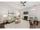 Comfortable living room featuring a brick fireplace, neutral decor, and ample natural light at 4507 Mackinac St, Charlotte, NC 28269