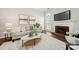Inviting living room featuring a fireplace, plush seating, and natural light from large window at 4507 Mackinac St, Charlotte, NC 28269