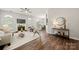Elegant living room with hardwood floors, a fireplace, and an open layout flowing into the dining area at 4507 Mackinac St, Charlotte, NC 28269