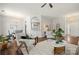 Bright living room with an open layout, hardwood floors, stylish furniture, and seamless access to dining and kitchen at 4507 Mackinac St, Charlotte, NC 28269
